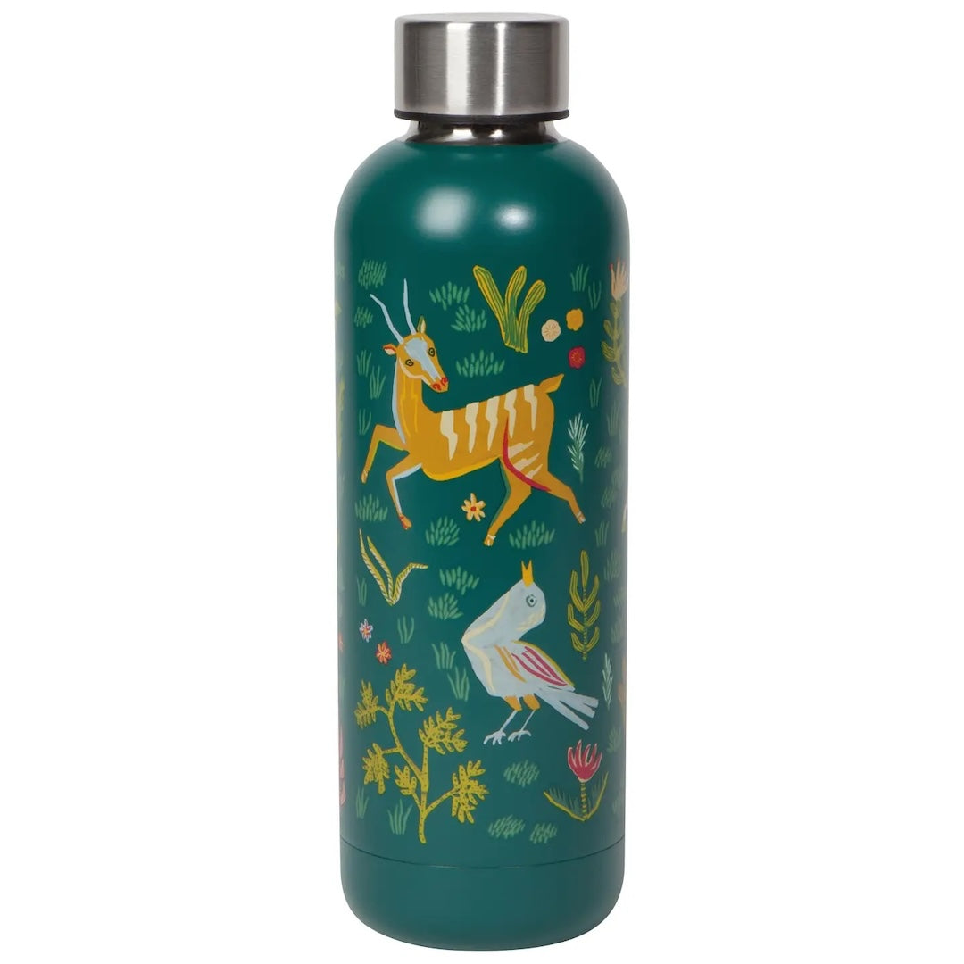 A green bottle with a Scandinavian forest scene on it.