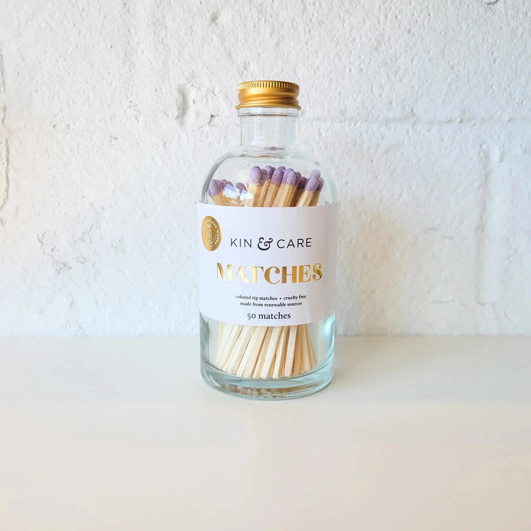 A glass bottle of matches with lavender tips