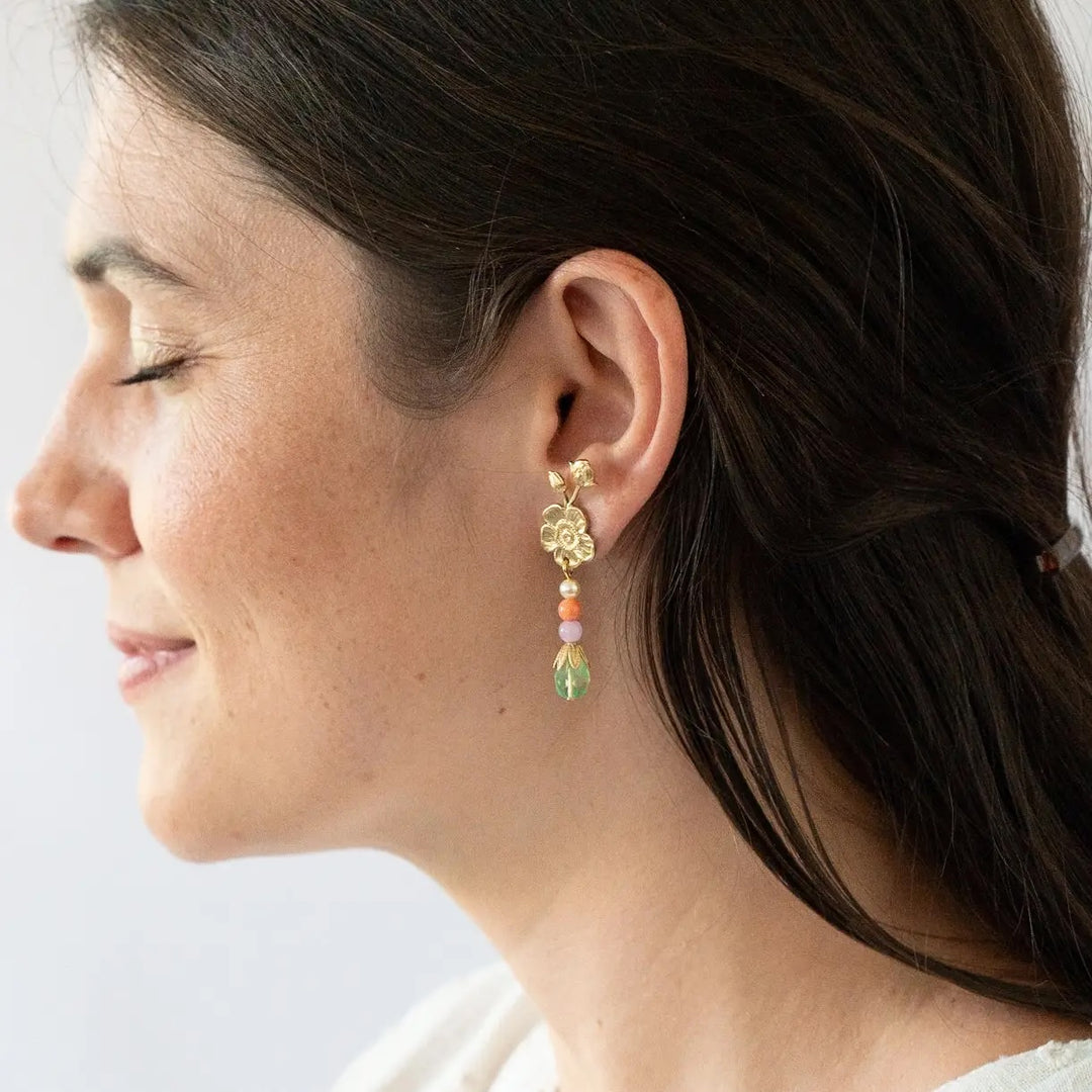 A lady wears Floral Dangle Stud Earrings w/ multicolor glass beads.